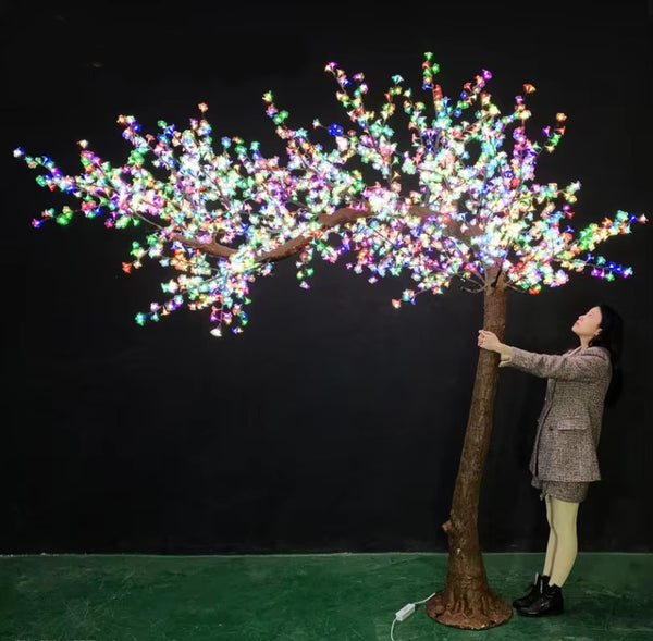Large multi-color LED tree for indoor and outdoor decoration, with realistic trunk.