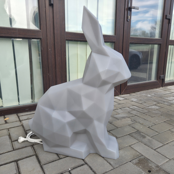 Geometric rabbit sculpture on a patio