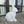 White rabbit-shaped lamp on a patio with glass doors in the background