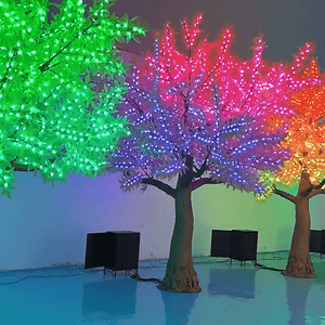 Vibrant rainbow LED light trees for indoor and outdoor decorative lighting.