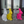 Four colorful rabbit-shaped sculptures in front of a glass door.