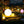 Decorative spherical lights in various colors on a garden path at night.