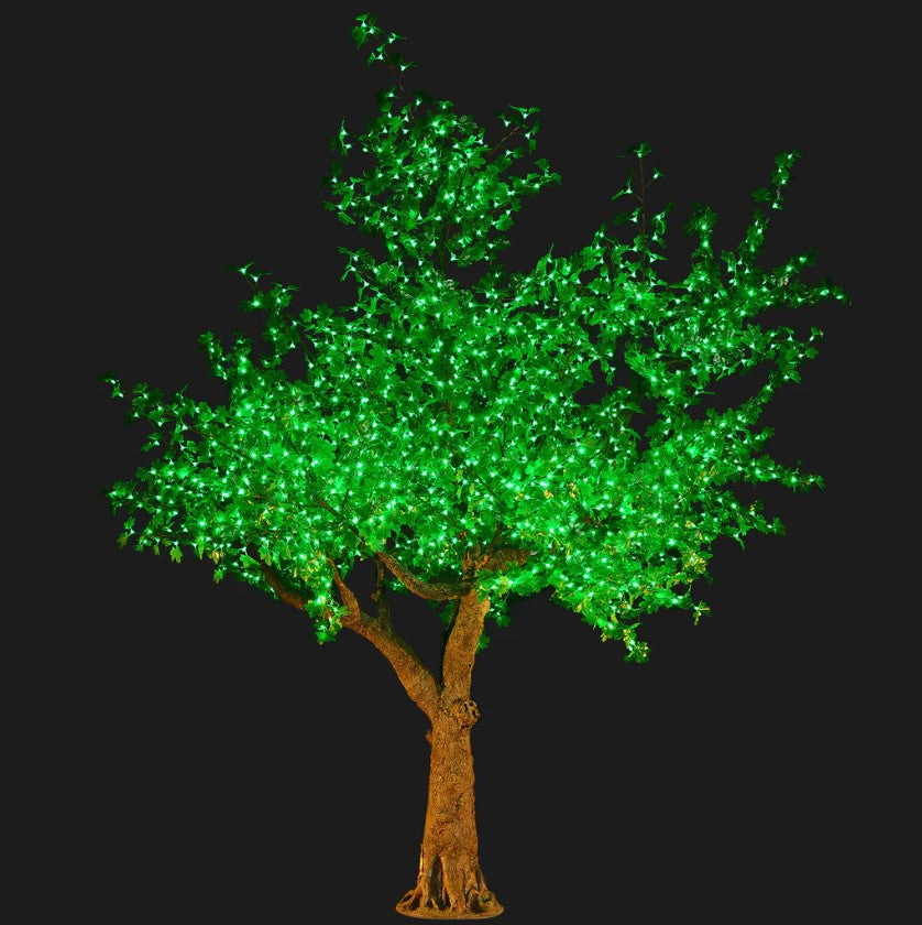 Large green LED tree with a realistic trunk for outdoor decorative lighting.