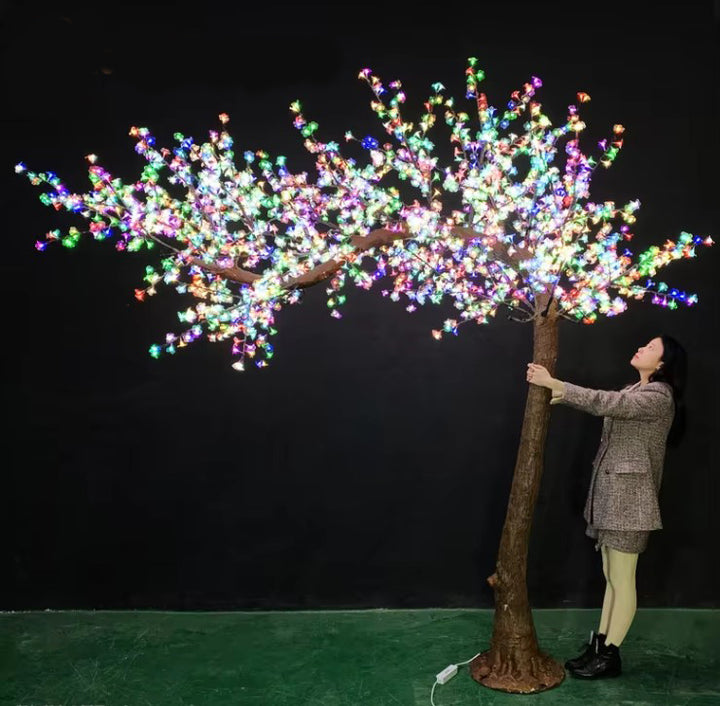 Large multi-color LED tree for indoor and outdoor decoration, with realistic trunk.